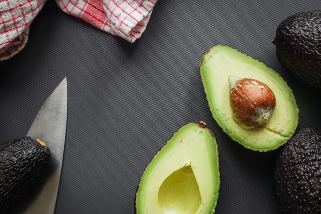 Beautifully arranged sliced avocado, highlighting its importance for heart health.