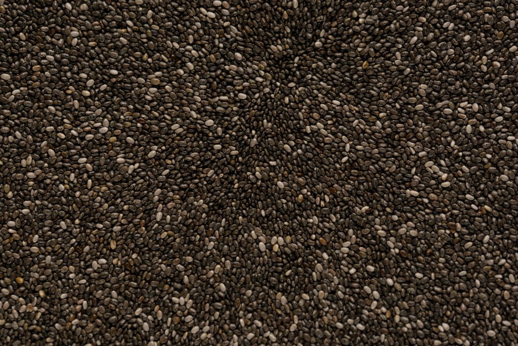 A close-up shot of flax seeds, a great source of heart-healthy nutrients like fiber and omega 3 fatty acids.
