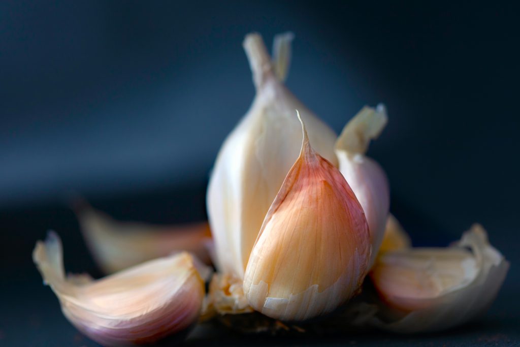An aesthetic shot of garlic cloves, emphasizing their importance as a natural remedy.