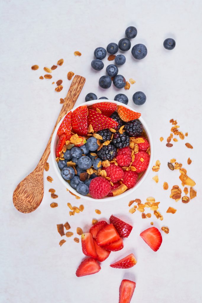 A bowl full of mixed berries, a rich source of antioxidants that fight free radicals.