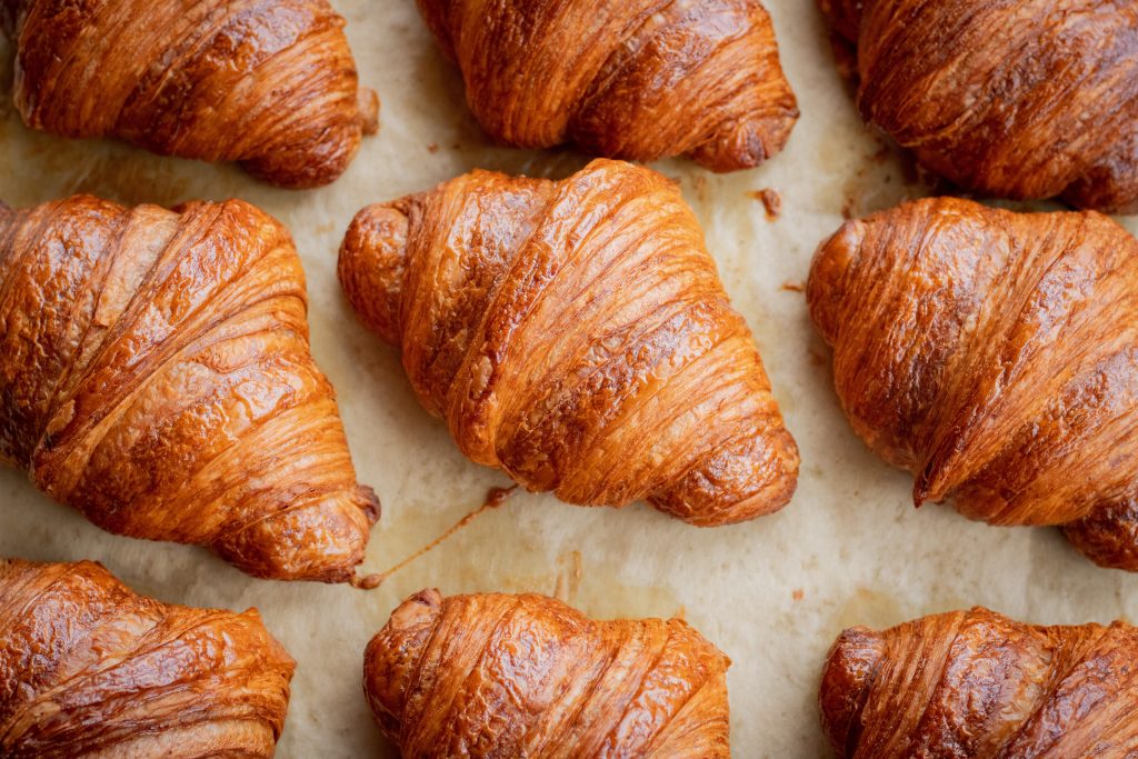 An enchanting image of freshly baked, crispy croissants.