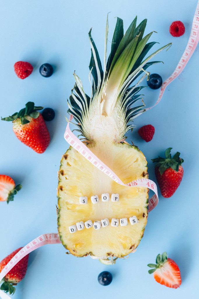 An aesthetic shot of fruits with a measuring tape, symbolizing common diabetes-related food myths.