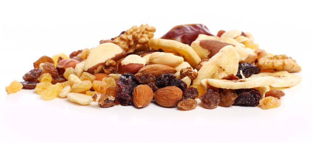 Close-up shot of assorted nuts against a white background.