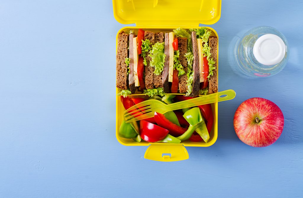 A school lunch box filled with healthy and nutritious food.