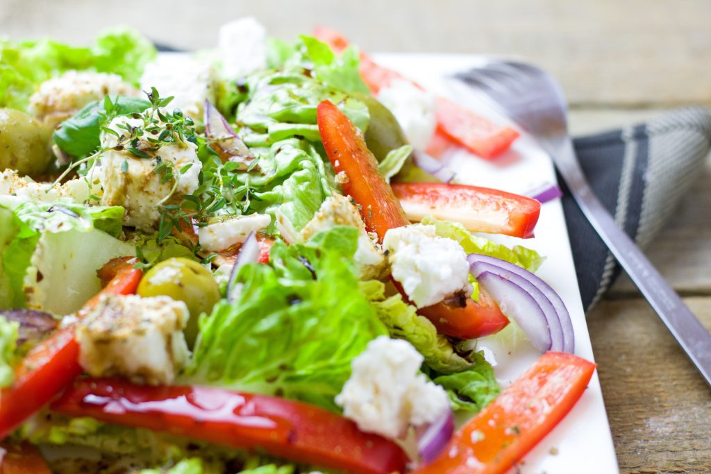 An aesthetic close-up shot of a vibrant vegetable salad, with a focus on the fiber-rich ingredients.