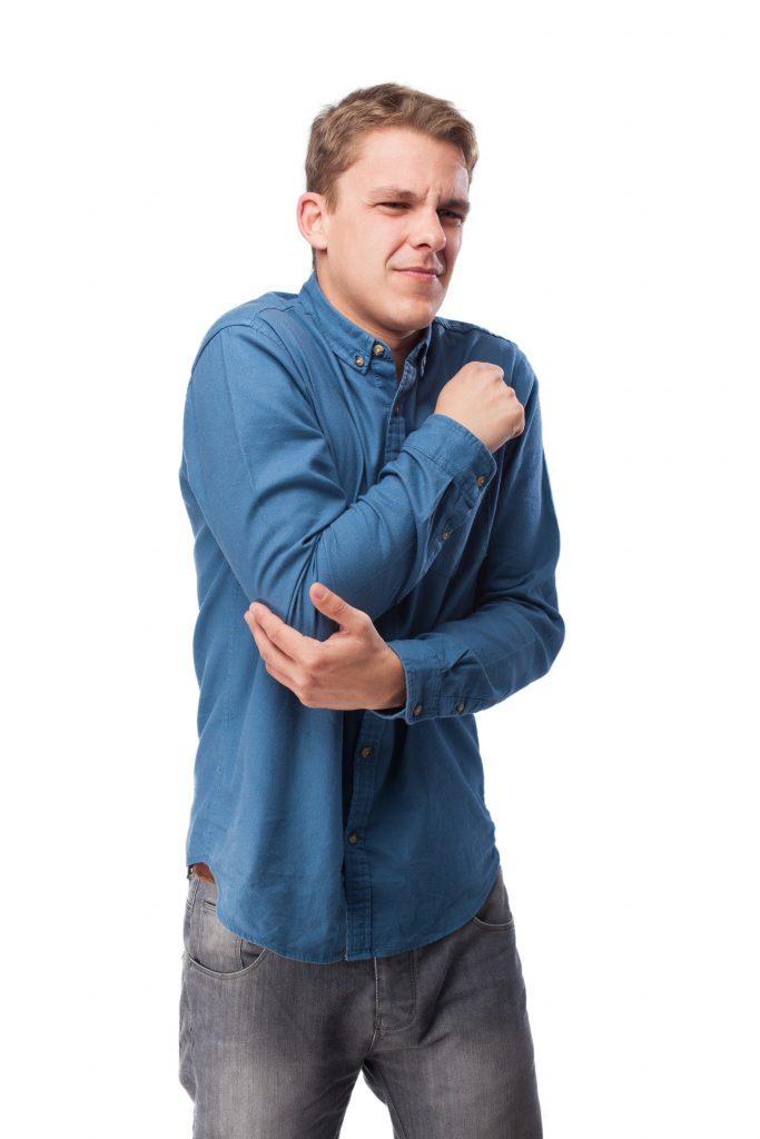 A man experiencing pain in his elbow caused by rheumatoid arthritis.