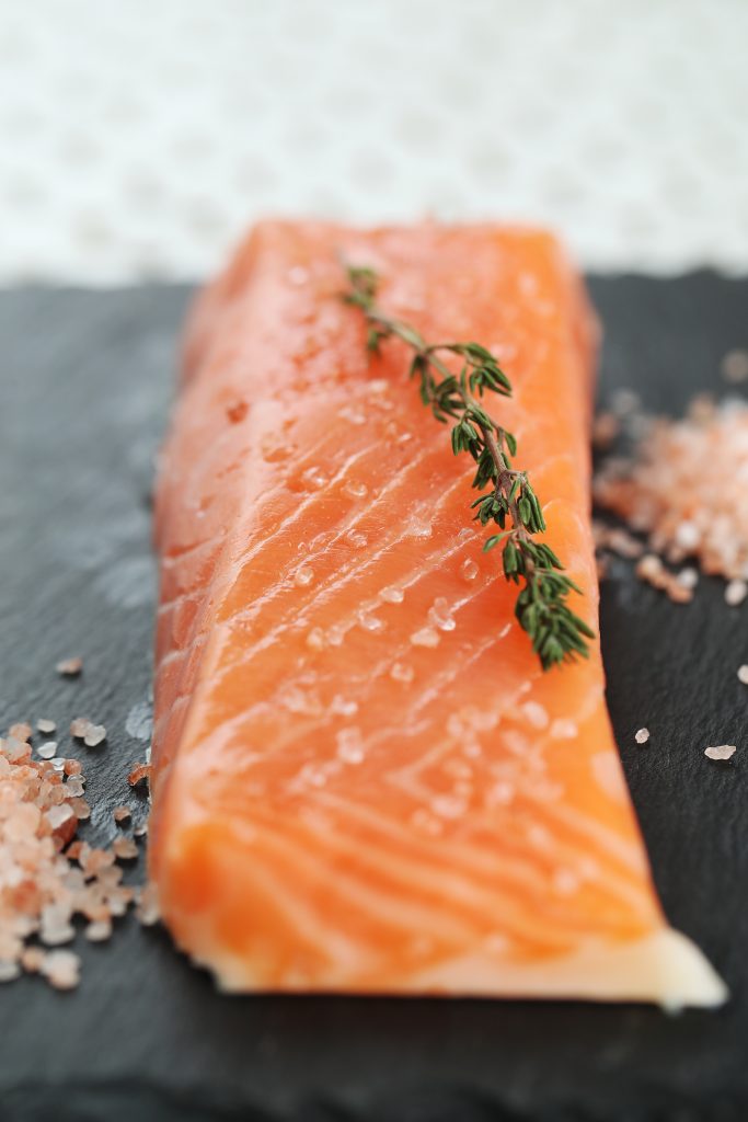 Thin slice of salmon, rich in inflammation-fighting omega-3 fatty acids, coated with brown sugar and herbs.