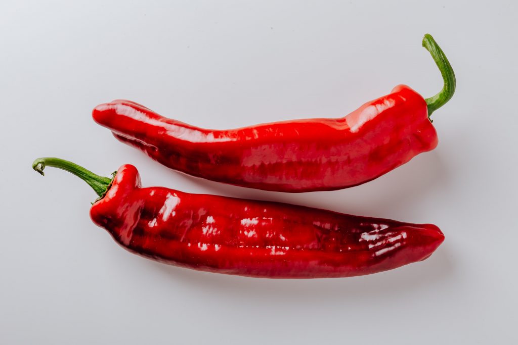 Red chili peppers showcasing a natural way to enhance metabolism and reduce appetite slightly.