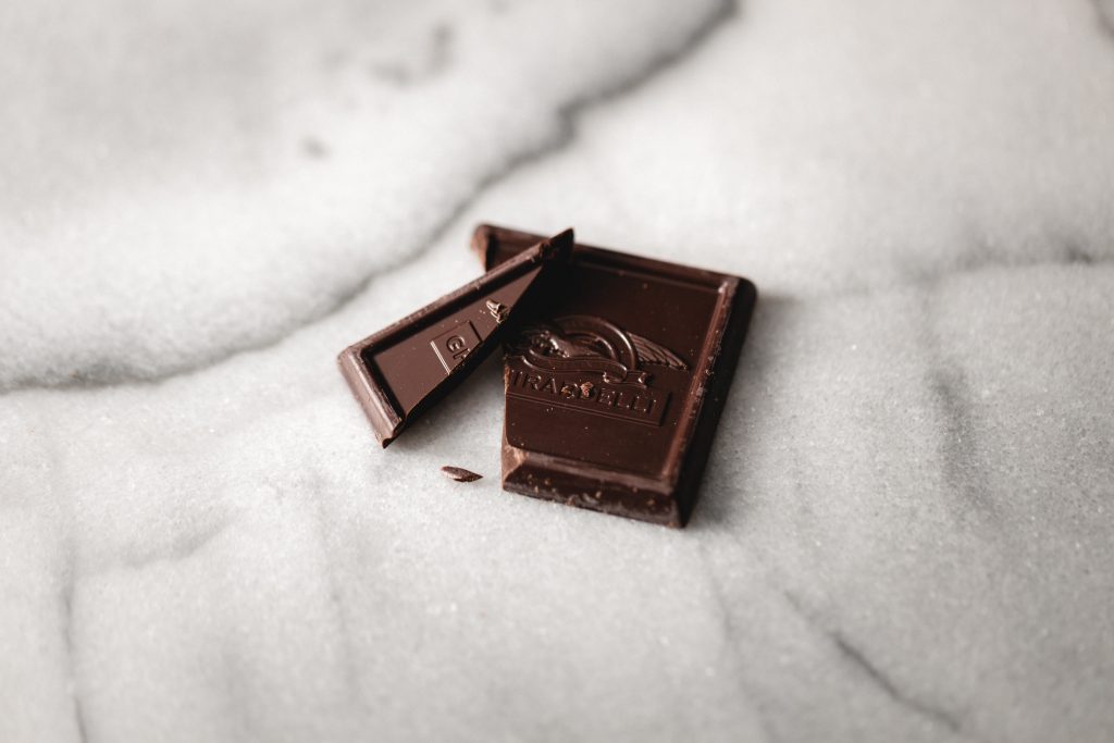 Pieces of dark chocolate, a delicious treat known for its potential to help lower blood pressure.