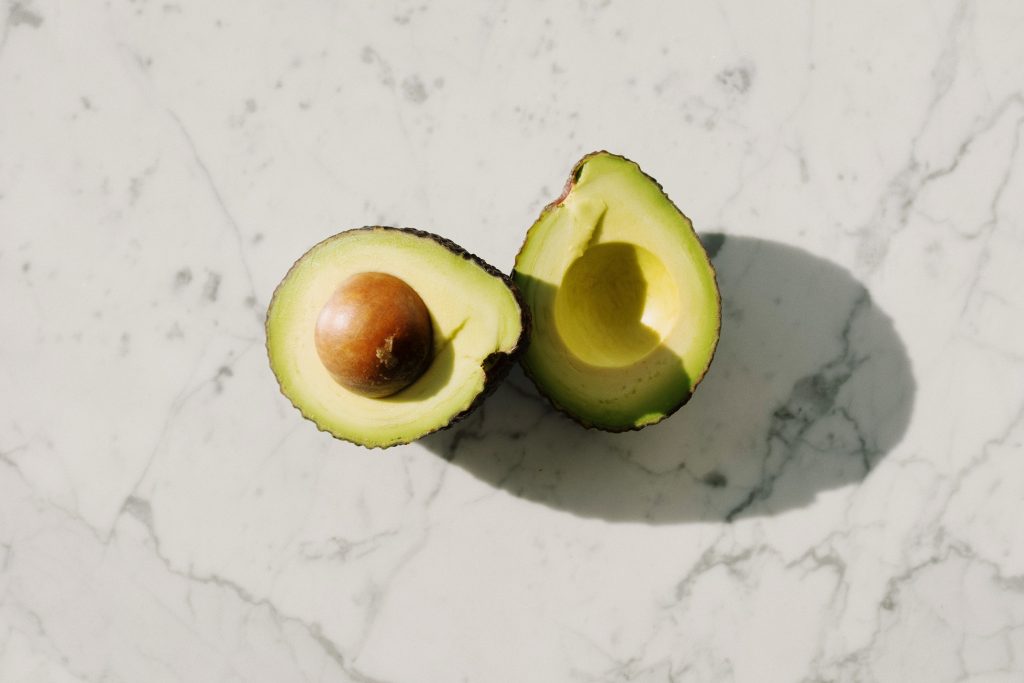 Avocado halves, packed with healthy fats, an excellent option for weight gain.