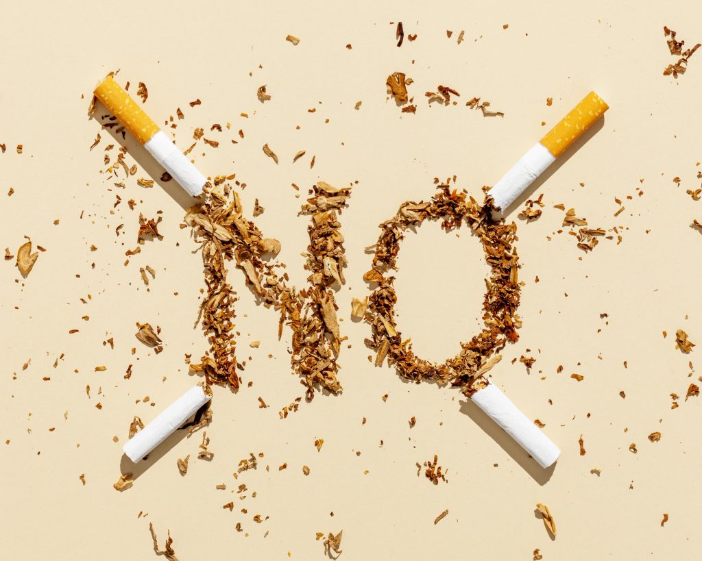 Dry chopped tobacco with the word 'No' on it, symbolizing the fight against smoking&rsquo;s health risks.