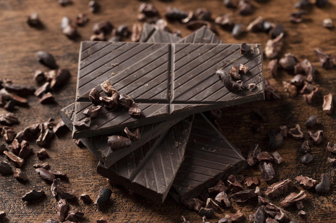 Close-up of dark chocolate with cacao nibs, a tasty treat to help maintain your magnesium levels through regular diet.