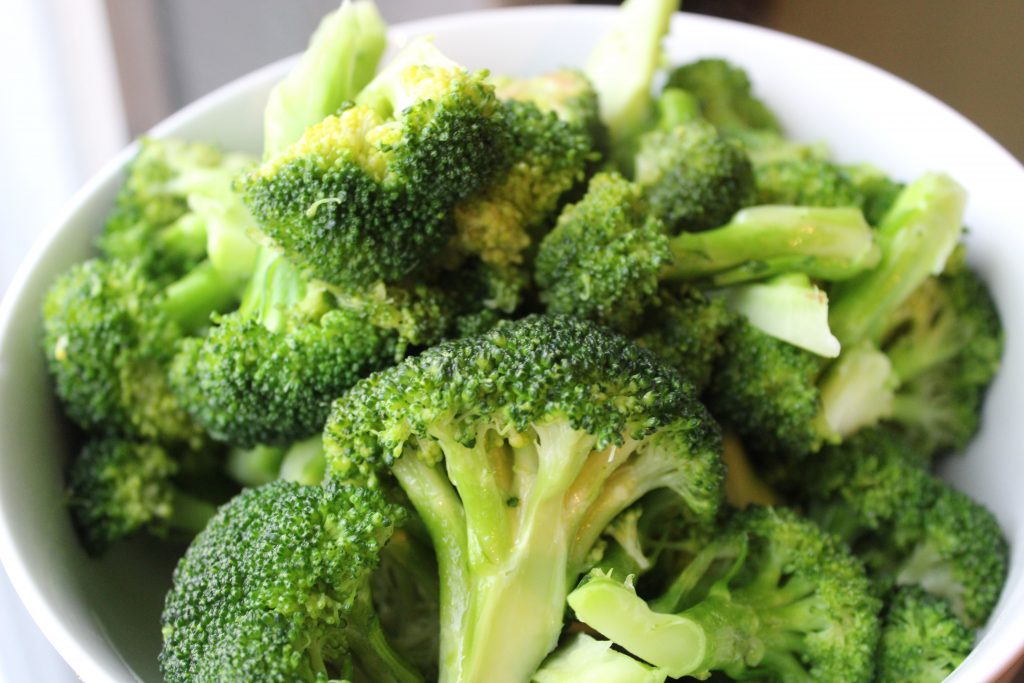 A bowl of fresh broccoli, a potassium-rich vegetable that helps meet your daily fiber needs.