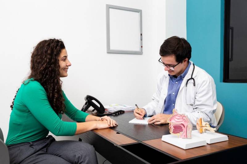 A woman receiving a checkup, emphasizing preventive care.