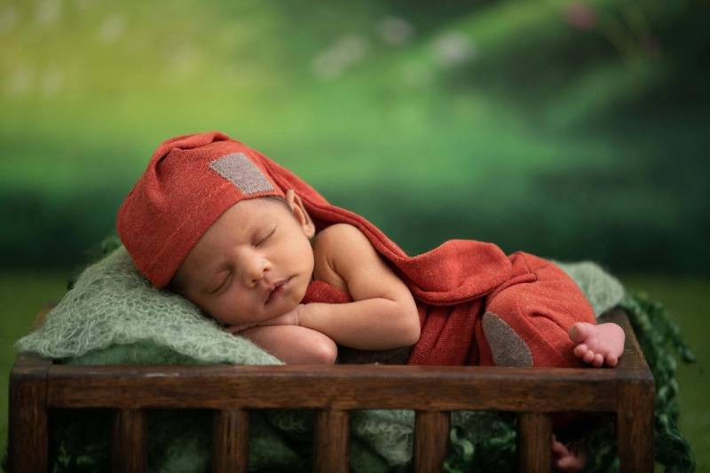 A baby napping comfortably, showcasing restful sleep.