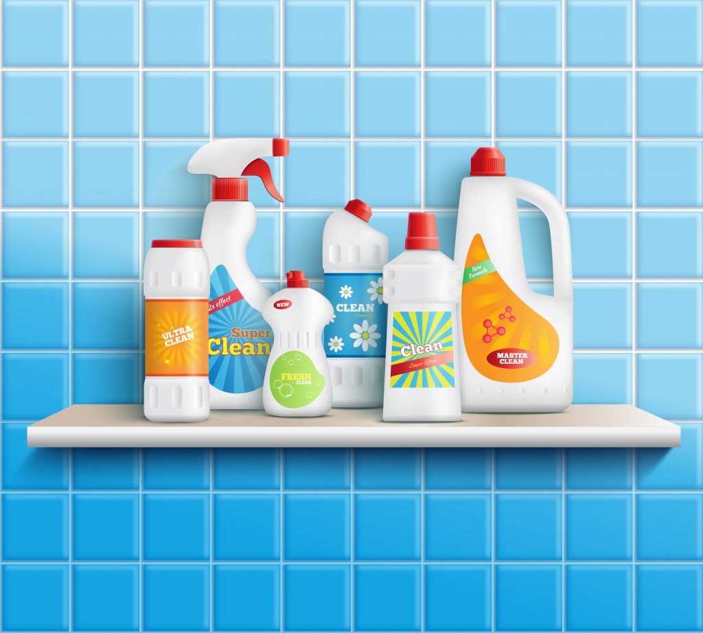 Home cleaning chemicals and disinfectants placed on a wall-mounted rack in the bathroom.