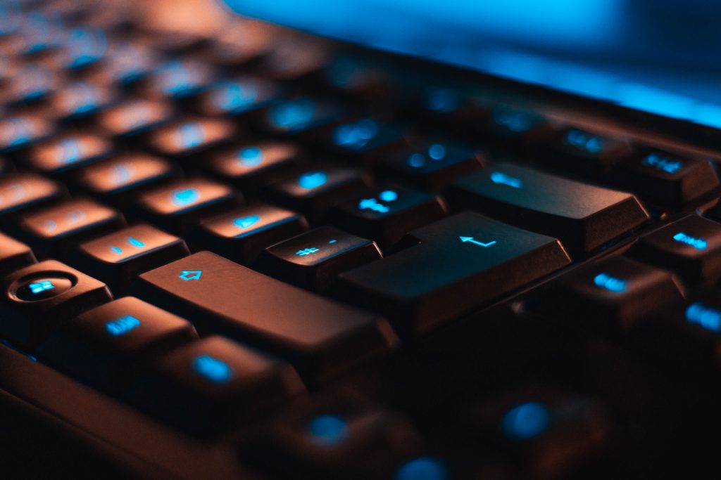 A close-up side view shot of a keyboard, reminding us that it’s probably time to give your keyboard a good clean.