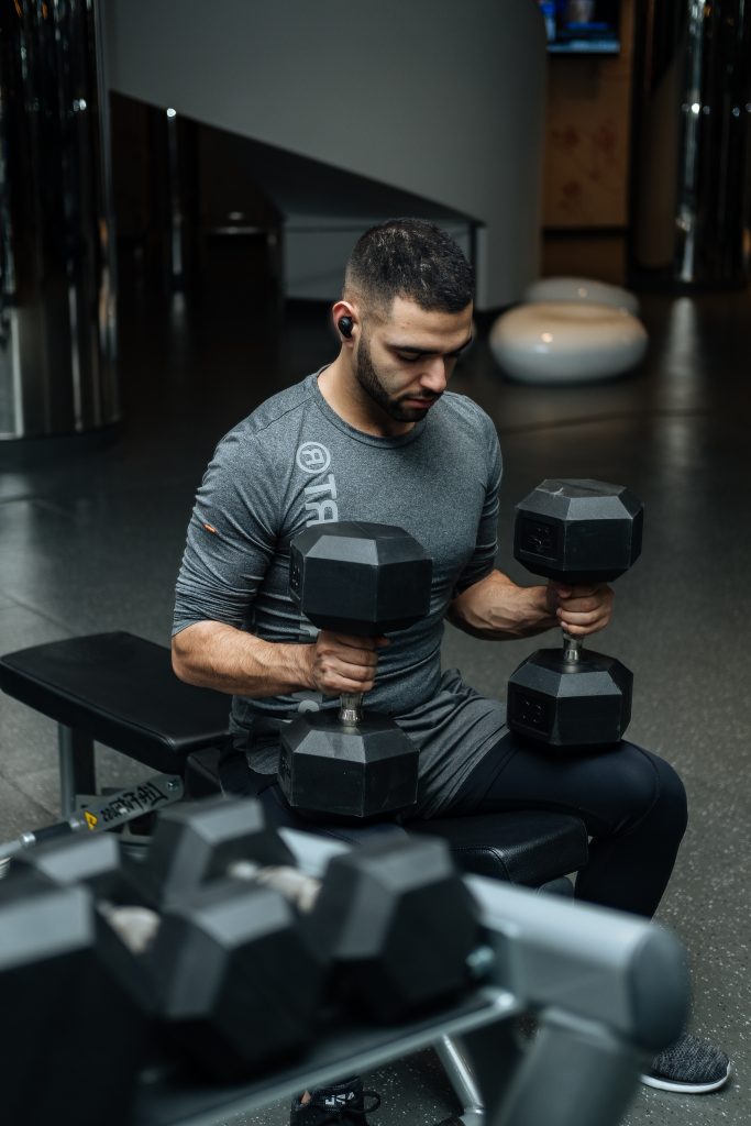Candid shot of a man engaged in gym training.