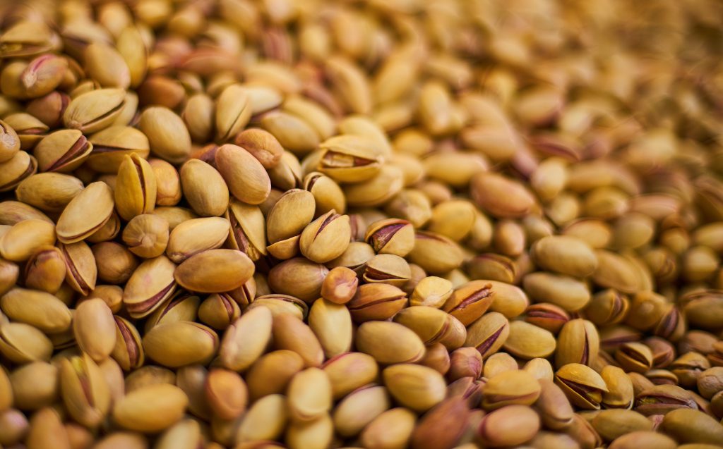 A close-up shot of pistachios, rich in sleep-promoting melatonin.