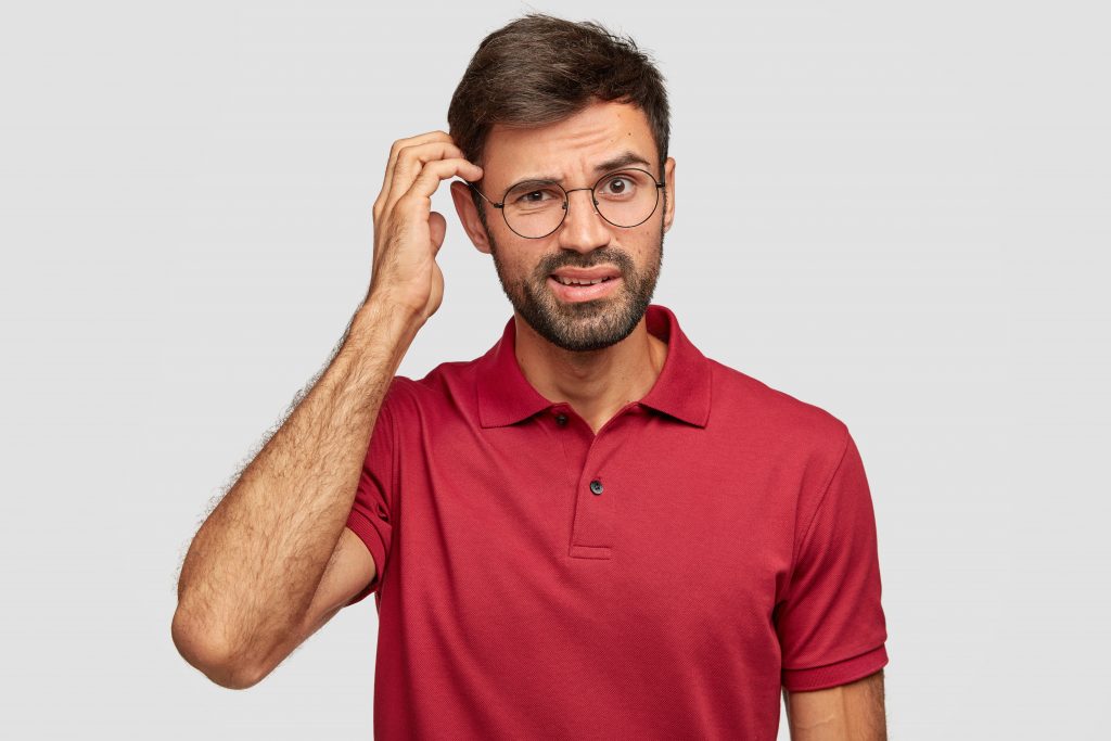 A young man looking puzzled, indicating possible cognitive decline.