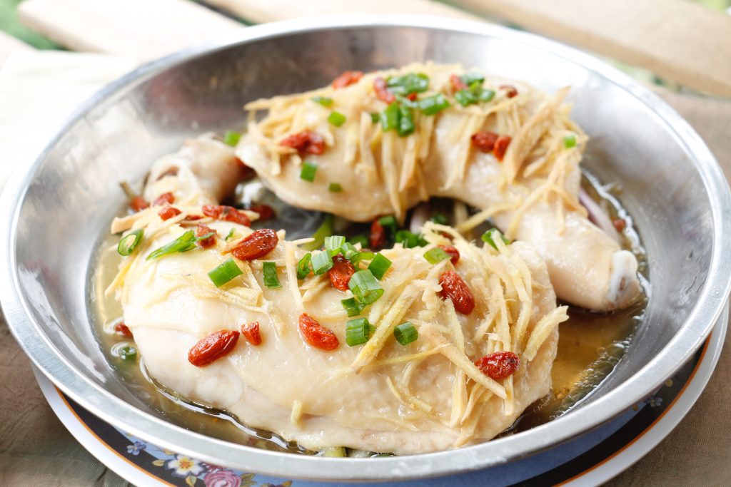 Steamed food in a steel bowl, offering a lower fat and fewer calorie option for healthier eating.