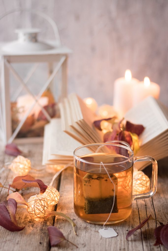 Aesthetic shot of black tea, known for its strong anti-inflammatory effects, served in a clear glass cup, showcasing its rich color and warmth
