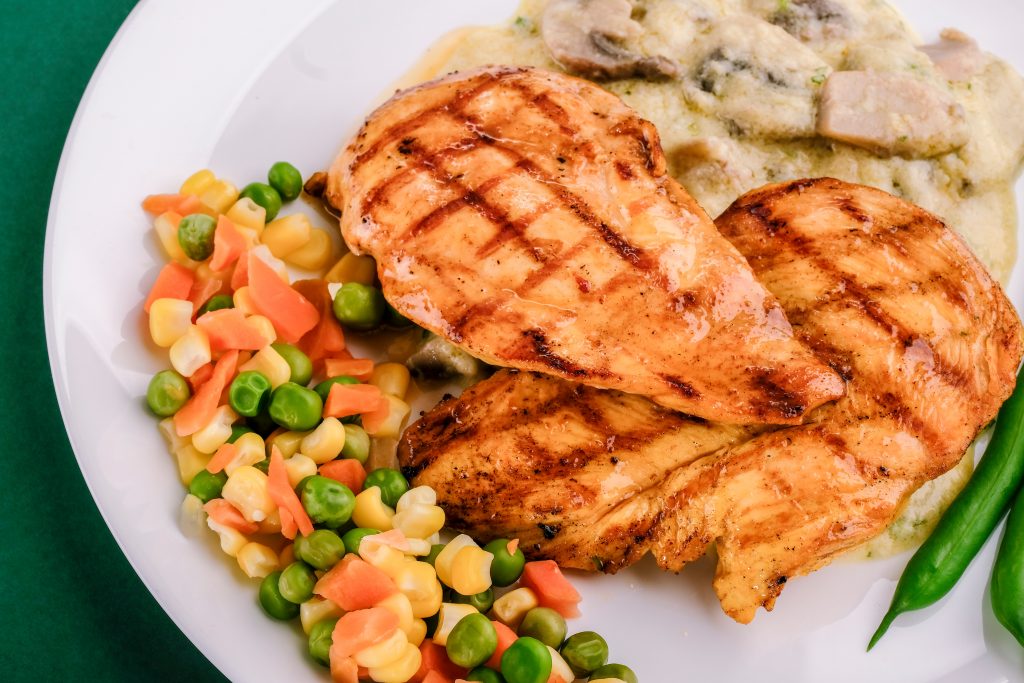 Grilled chicken with mixed veggies and creamy mushroom , a protein-packed meal for weight loss.