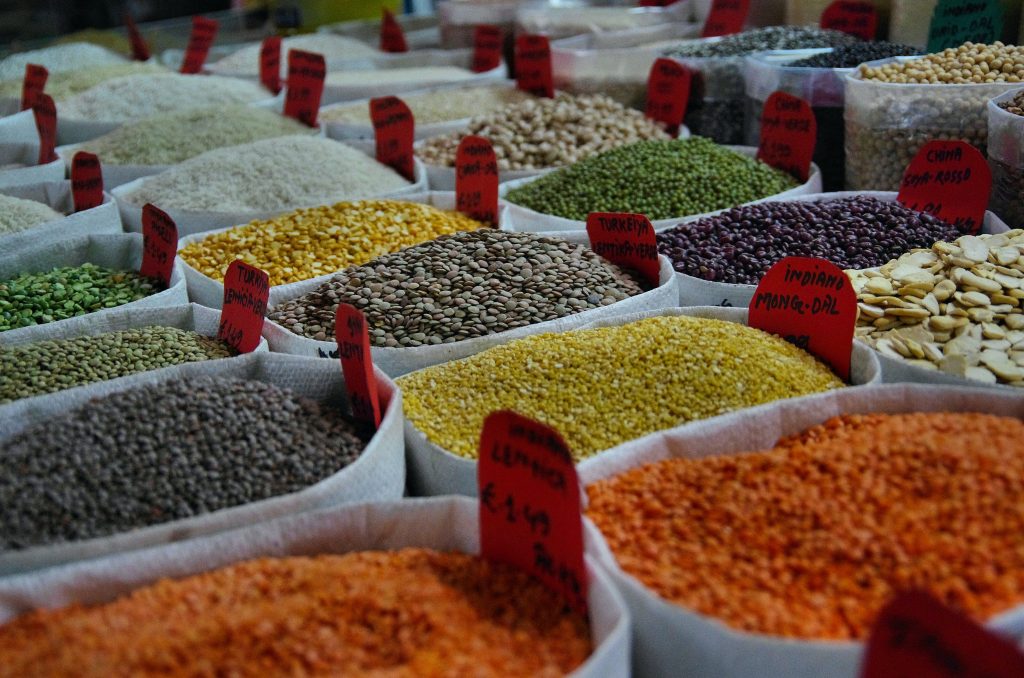 Display of various legumes in a sack, relating to the concept that digesting whole grains uses extra energy.